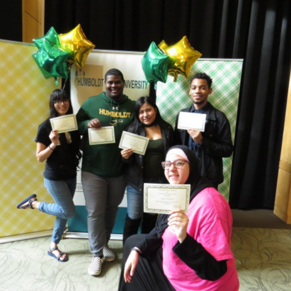 Students standing with certificates 